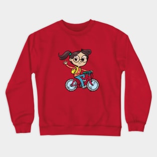 cheerful girl rides a bicycle and waves Crewneck Sweatshirt